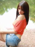 Sweet Ann Angel In Blue Jean Mini Skirt And Red T-Shirt Spreads Poses On The Bank Of The River