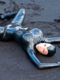 Hot Bodied Latex Doll Bianca Beauchamp Poses In Wet Black Sand On The Beach